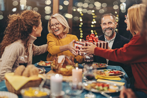 Happy group having dinner at a holiday party.